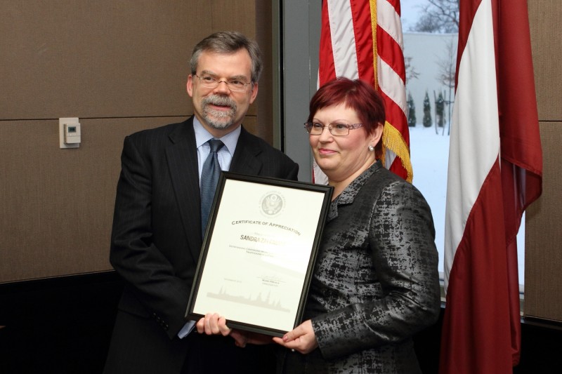Receiving award from the US Embassy to Latvia